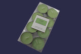 Set of eight green candles in a clear plastic packaging on a white background