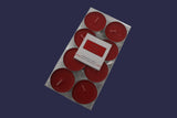 Set of eight red candles in a clear plastic packaging on a white background